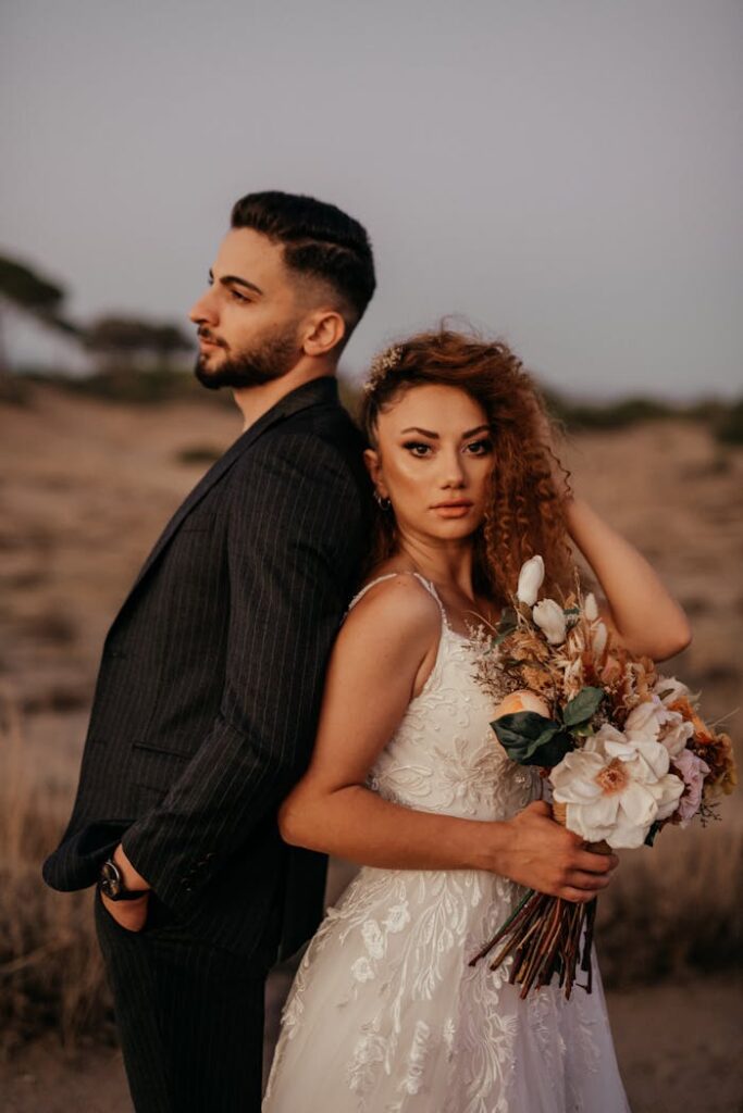a-bride-and-groom-standing-in-the-desert-15861957 A bride and groom standing in the desert
